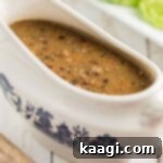 Close up of southern giblet gravy in a gravy boat, ready to be served.