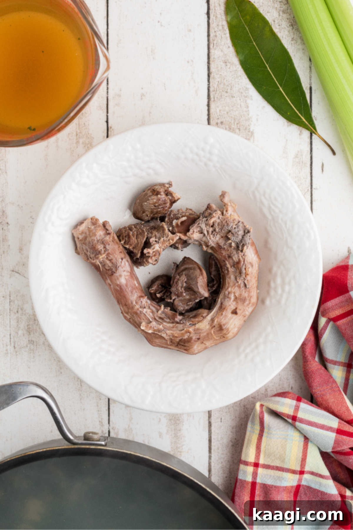 Some cooked turkey giblets in a bowl, ready to be picked clean for the gravy.