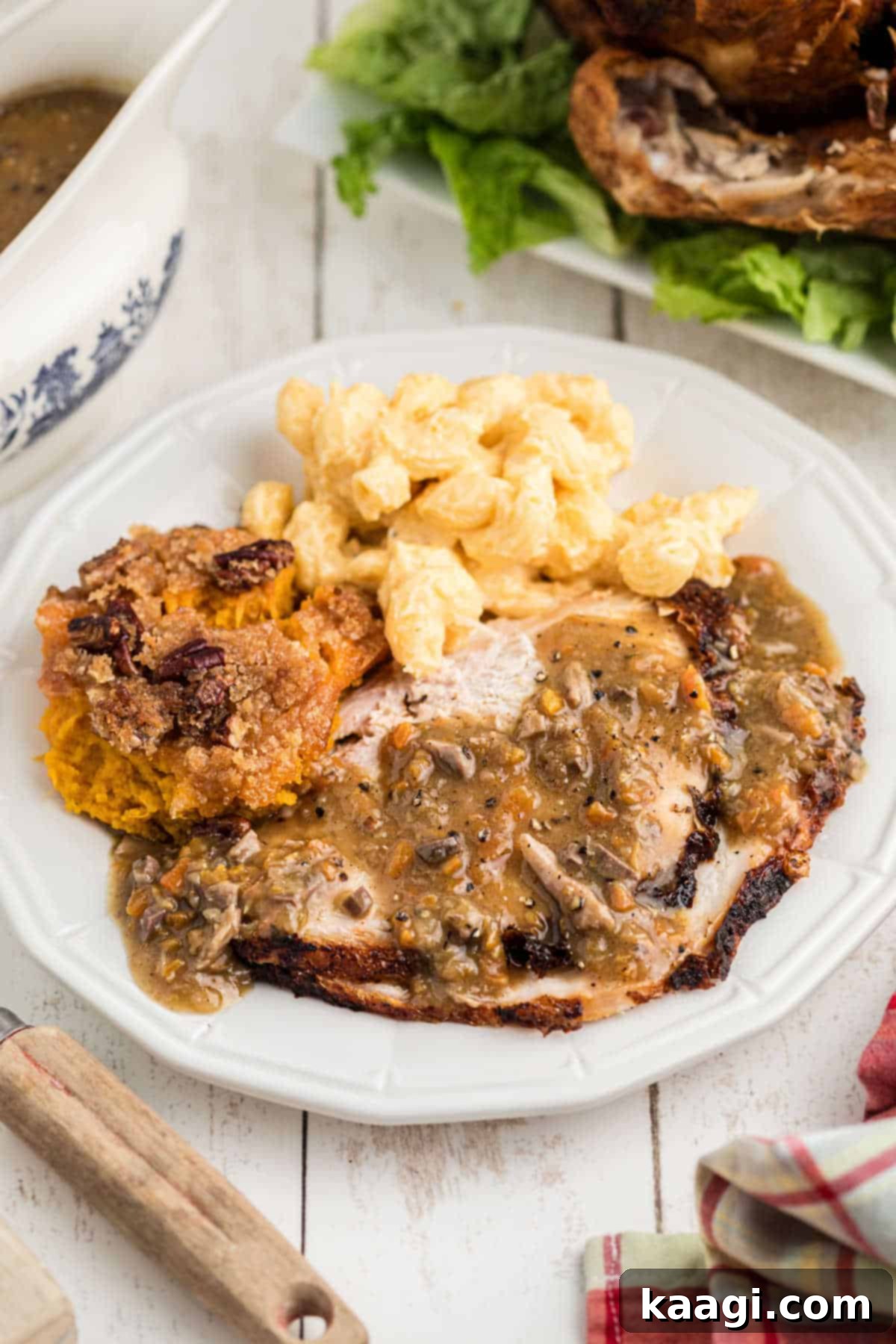 Crisp and Juicy Turkey Triumph 11 A plate featuring a generous serving of deep fried turkey with classic side dishes and giblet gravy.