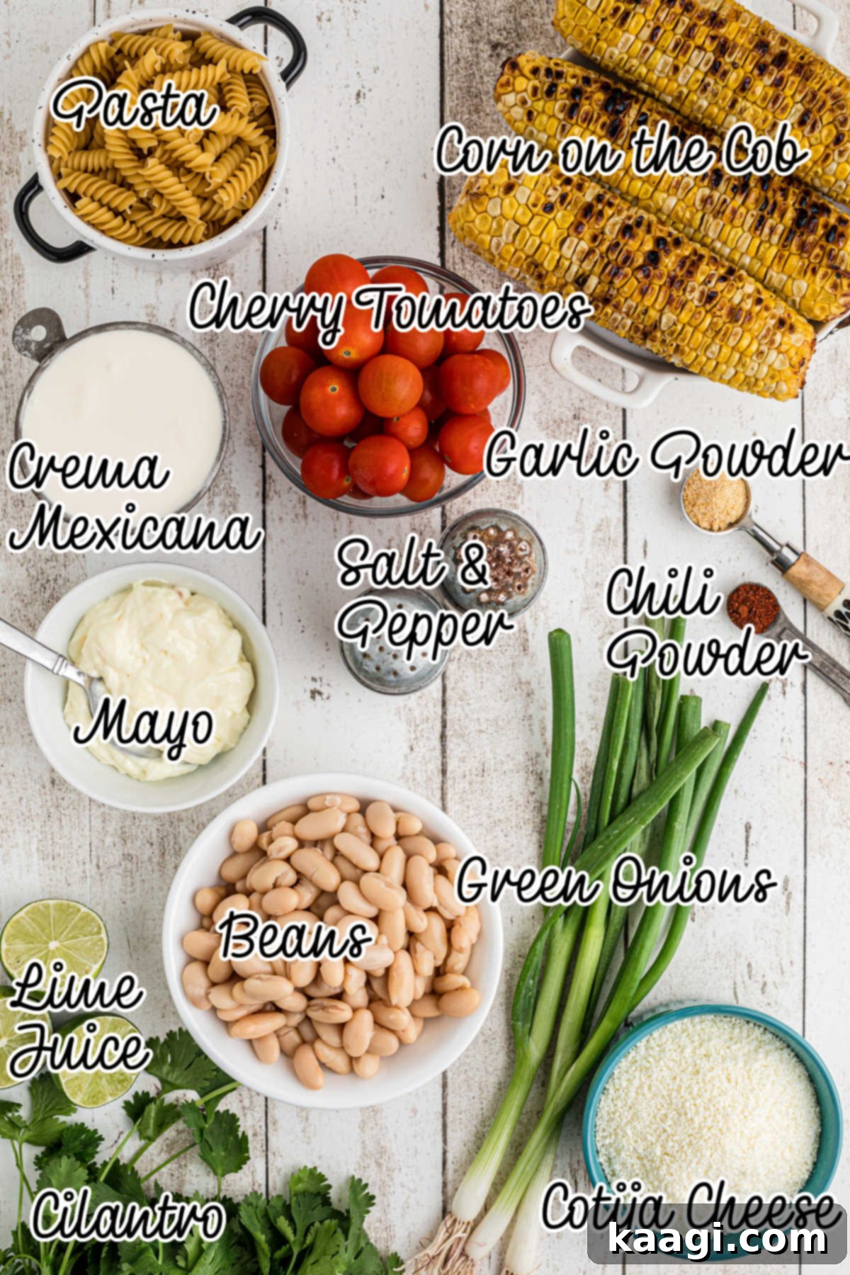 Overhead shot of all the fresh ingredients needed to make Elotes pasta salad, arranged artfully.