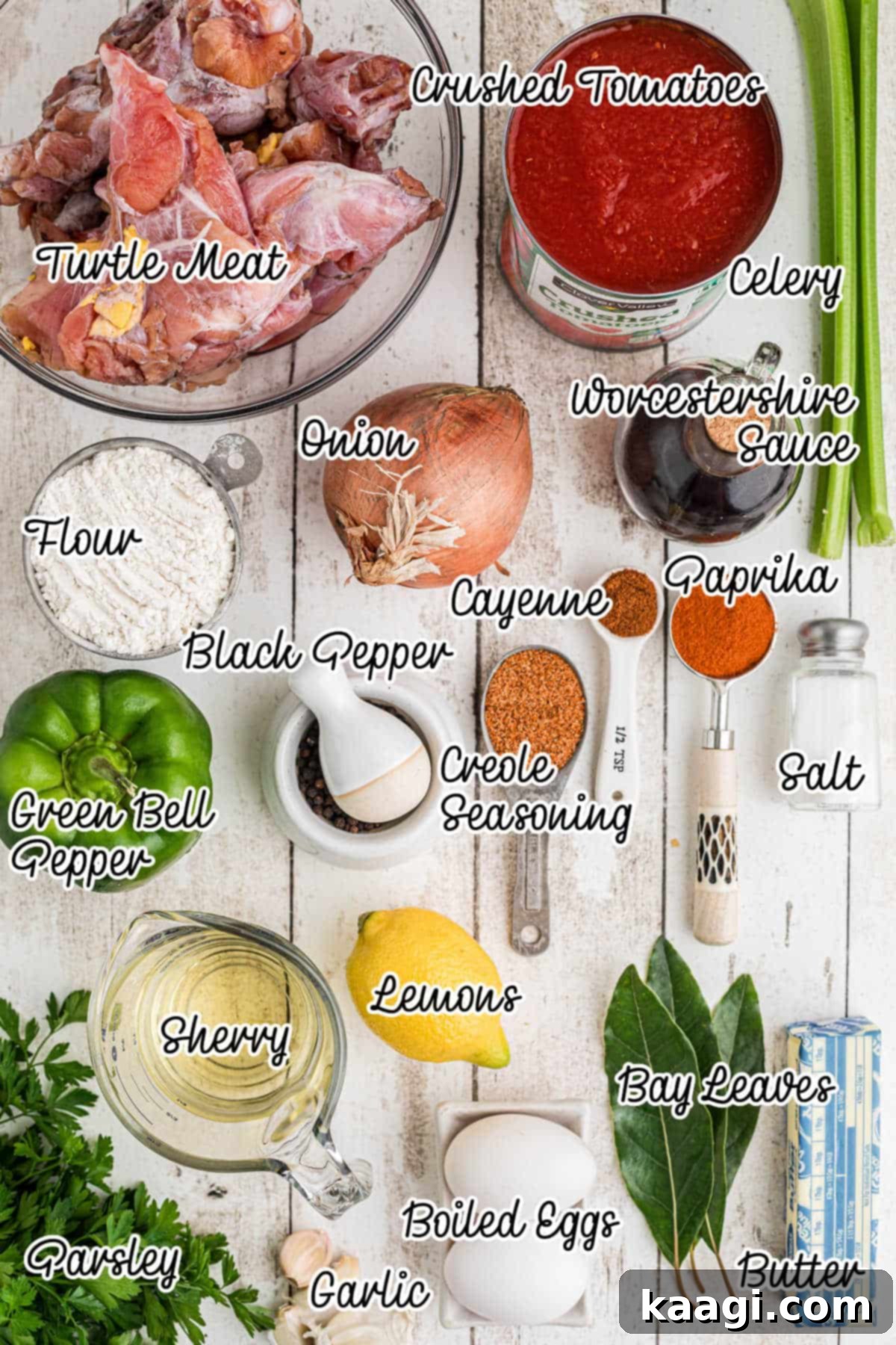 Overhead image of a collection of fresh ingredients like onions, celery, bell pepper, and spices, laid out for making Creole Turtle soup.