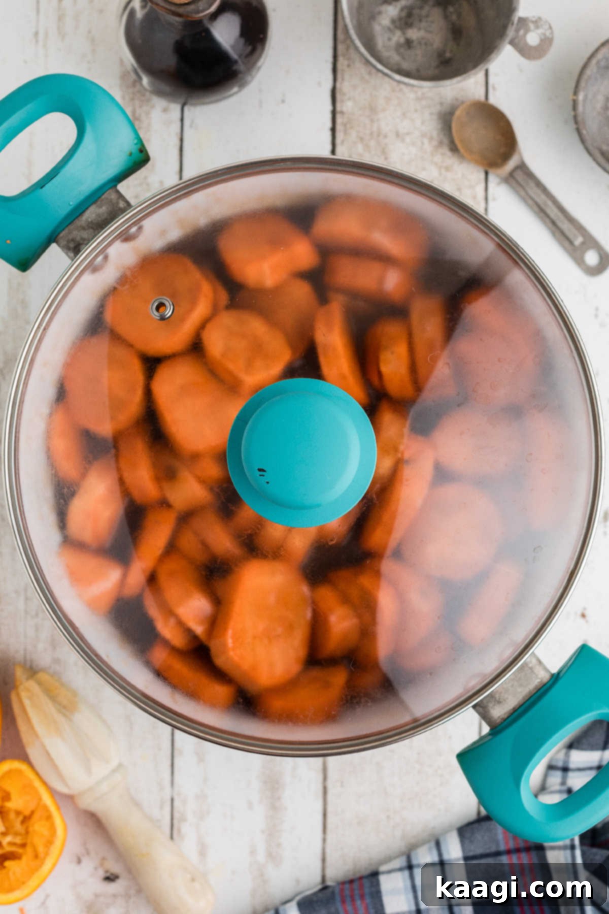 A covered pot of sweet potato slices.