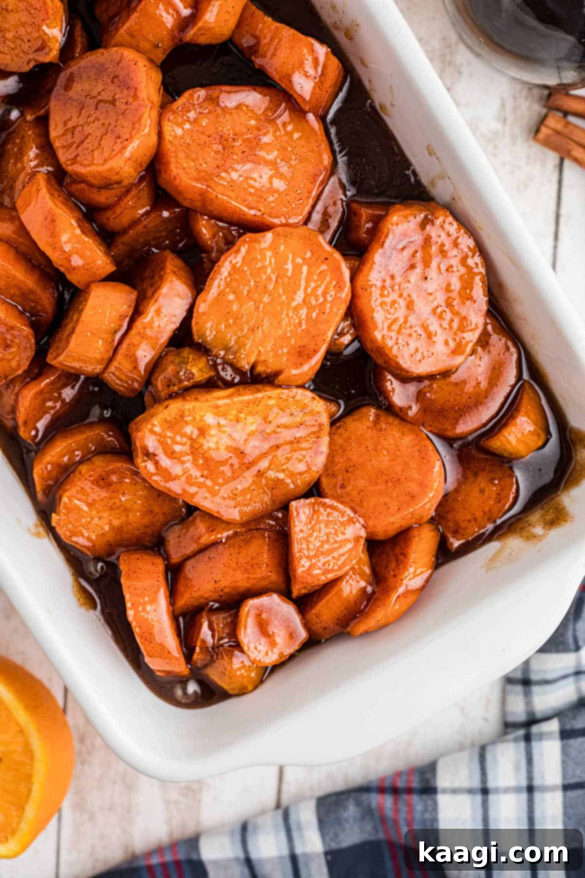 An overhead shot of a dish filled with candied yams.