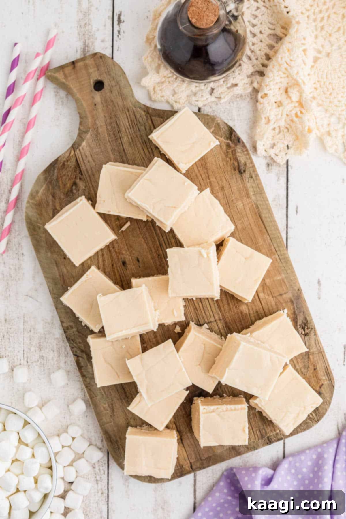 Overhead shot of a pile of vanilla fudge cut into perfect squares, ready to serve.