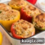 Bell Pepper Boats 9 Baking dish full of perfectly cooked stuffed bell peppers with a golden-brown topping.