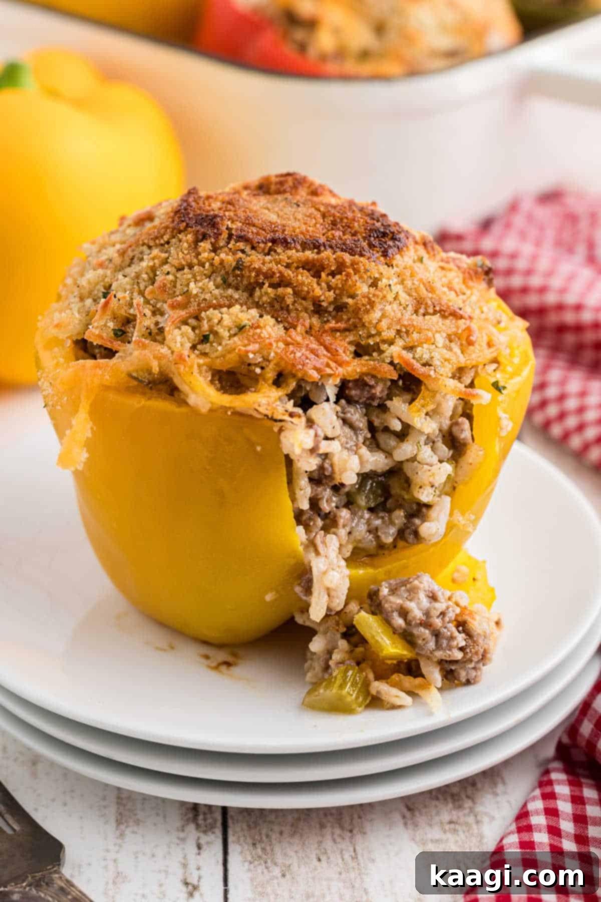 Bell Pepper Boats 8 A perfectly cooked stuffed bell pepper, cut open to reveal the rich, savory filling inside.