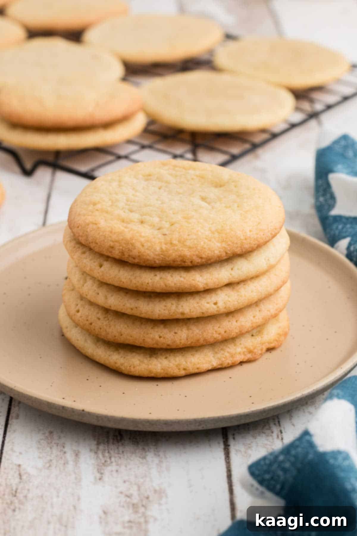A pile of old fashioned tea cakes on a plate, ready to be served.