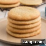 A pile of old fashioned tea cakes, on a plate, the image is cropped square.