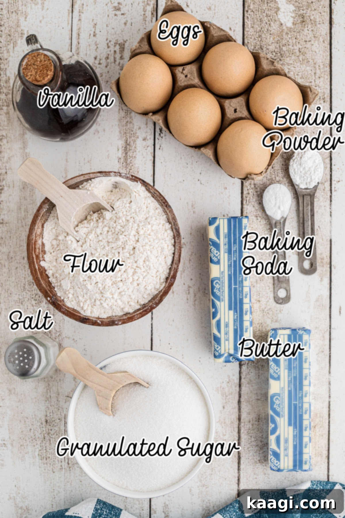 Overhead image of ingredients needed to make old fashioned tea cakes, including flour, sugar, butter, and eggs.