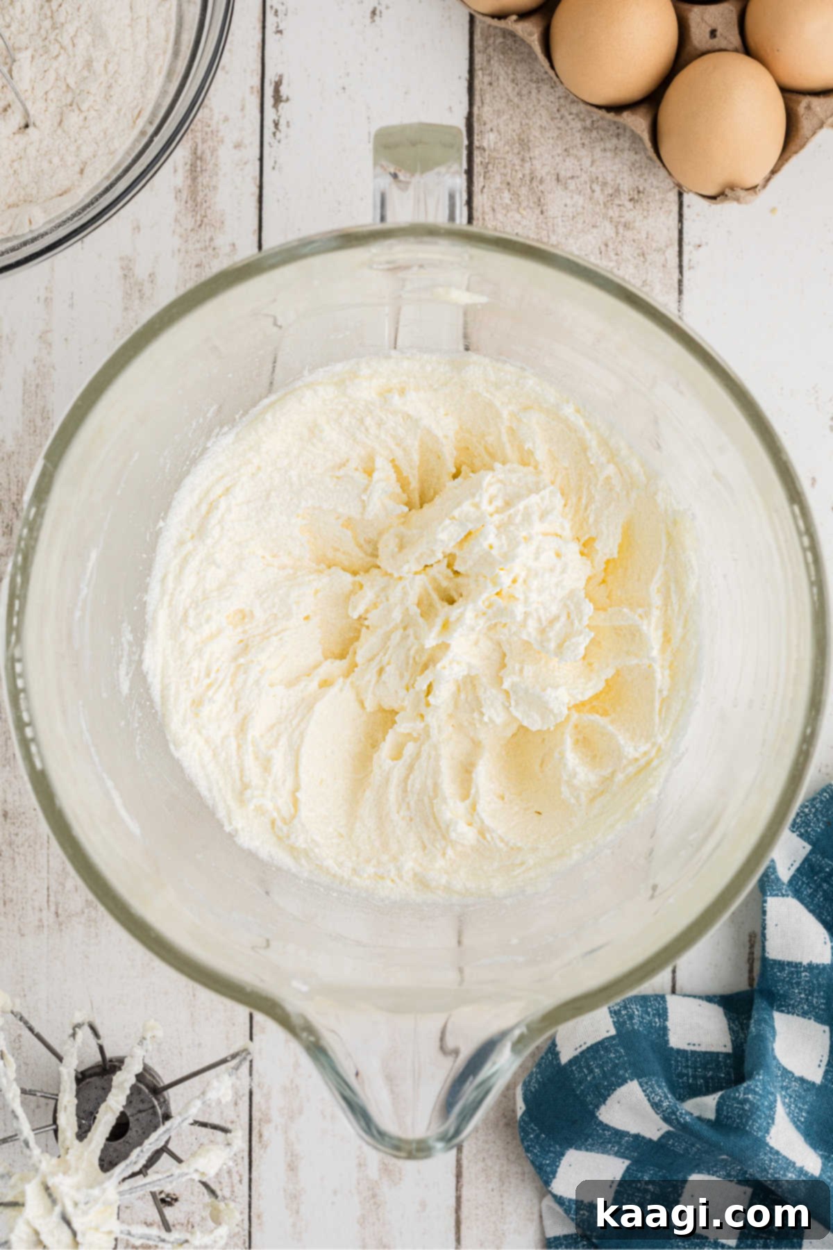 A large mixing bowl with butter and sugar, being creamed together.