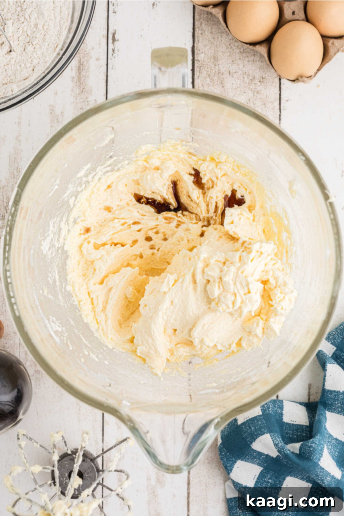 Vanilla extract being added to the wet batter.