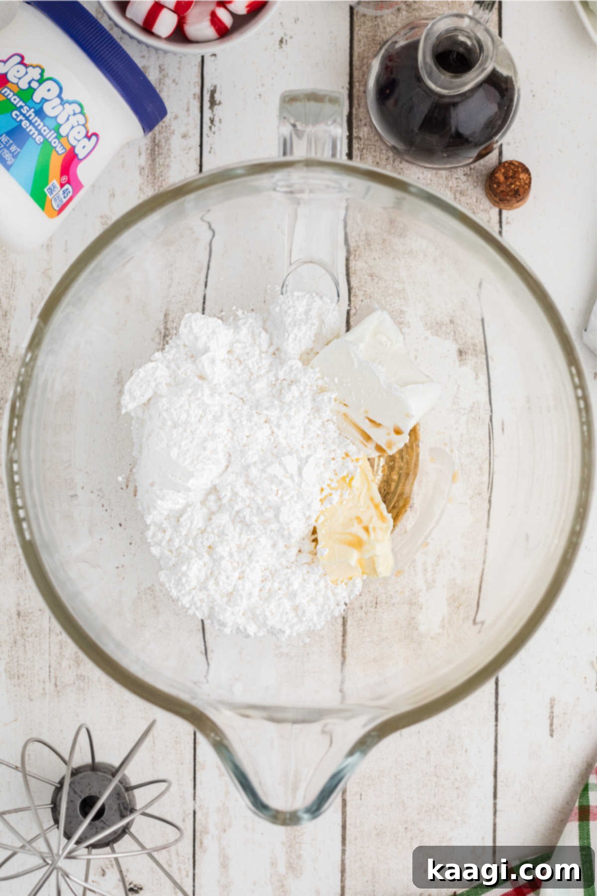 Shortening and other ingredients added to a mixing bowl.