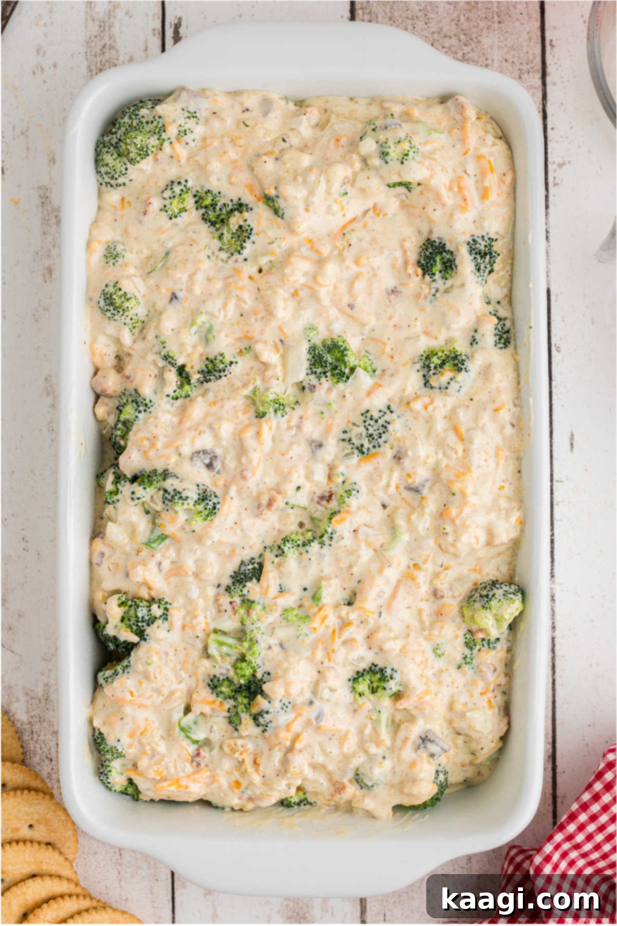 The combined broccoli casserole mixture smoothly poured into an 11x7 inch baking dish.