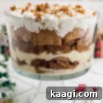 A gingerbread trifle in a glass trifle bowl, showcasing its layers.