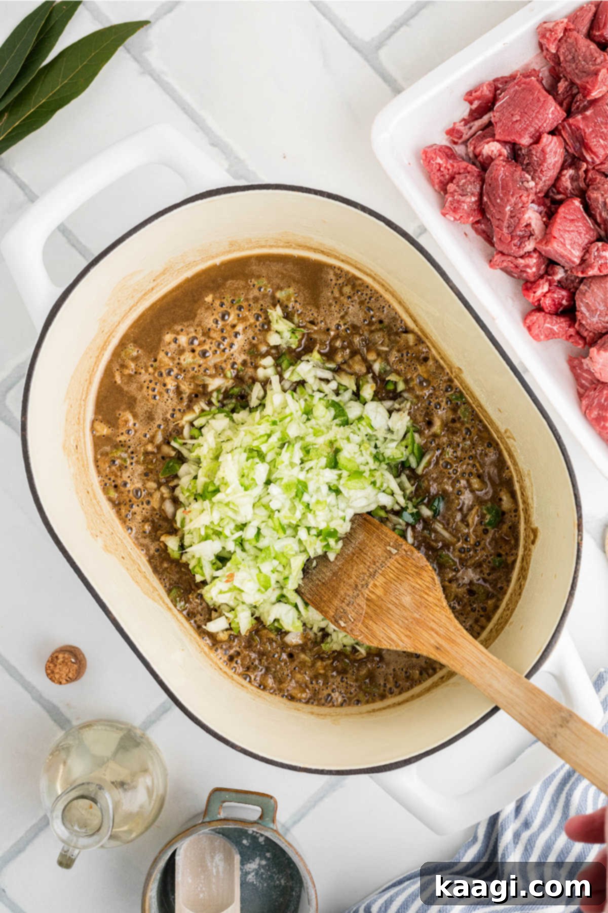 Soulful Southern Beef Gumbo 6 Onions and peppers added to a pot of roux.