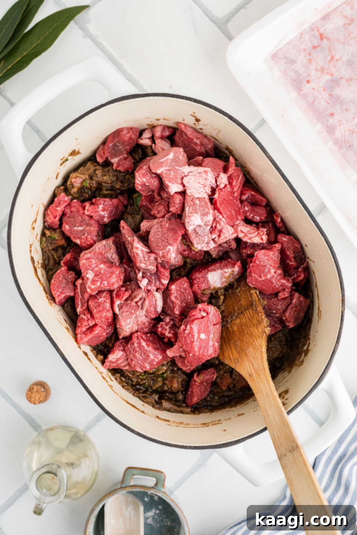 Soulful Southern Beef Gumbo 9 Beef stew meat added to a pot full of other ingredients.