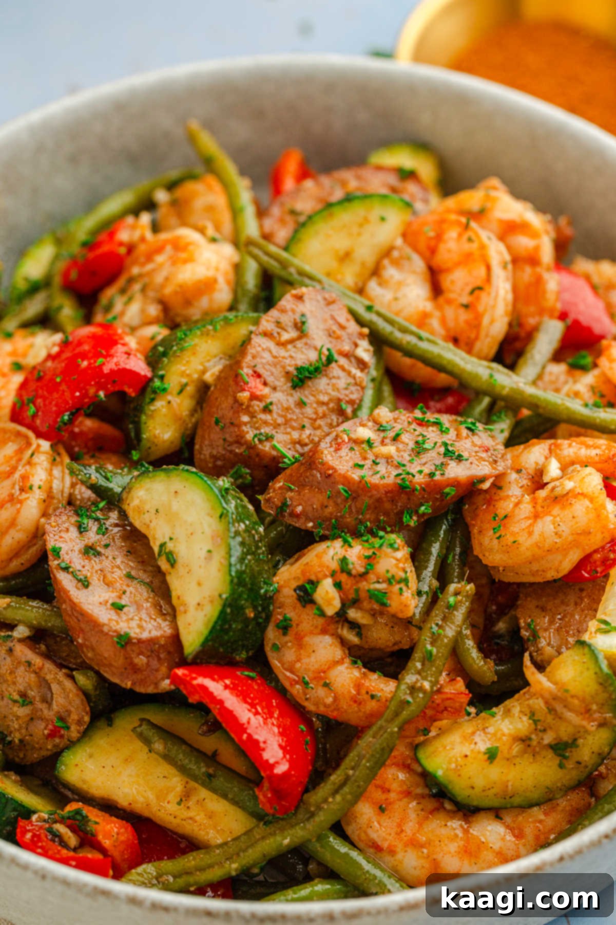 Cajun Shrimp and Sausage Sheet Pan Bake 6 Bowl of sheet pan Cajun shrimp and sausage dish.