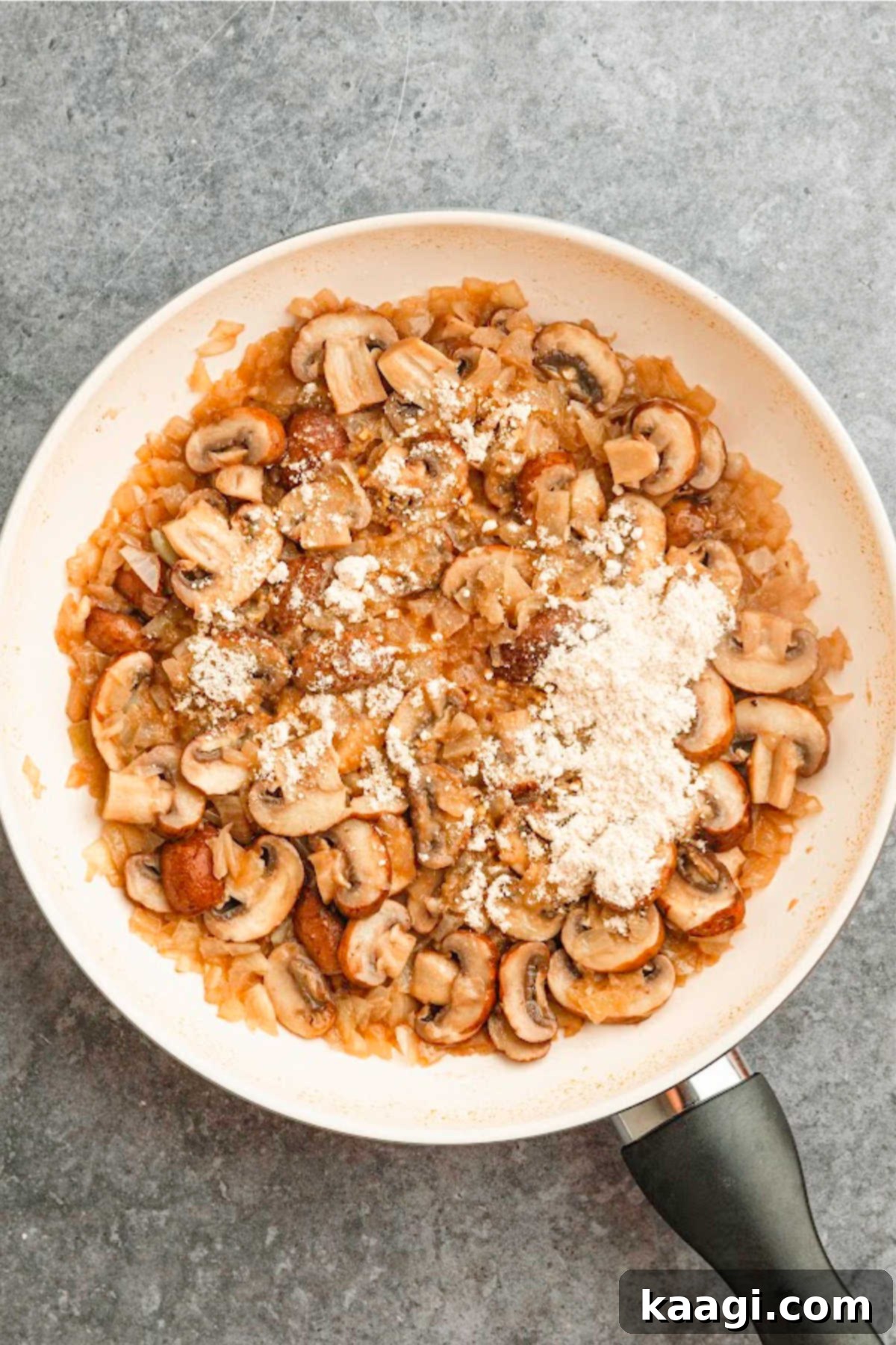 Louisiana Chicken Stroganoff 6 A large skillet with browned chicken, with flour added.