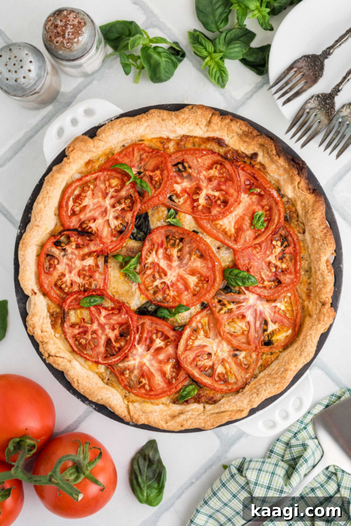 Dixie Tomato Tart 2 Long image of an overhead shot of a classic Southern Tomato Pie, golden and inviting.