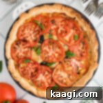 Dixie Tomato Tart 13 Overhead shot of a perfectly baked Southern Tomato Pie, golden and inviting.