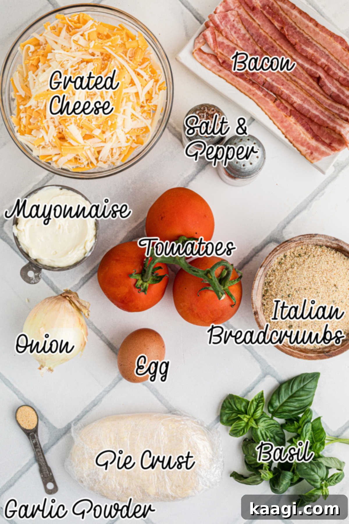 Dixie Tomato Tart 3 Overhead shot of all the fresh groceries needed to make a vintage southern tomato pie, including vibrant tomatoes, cheese, basil, and bacon.