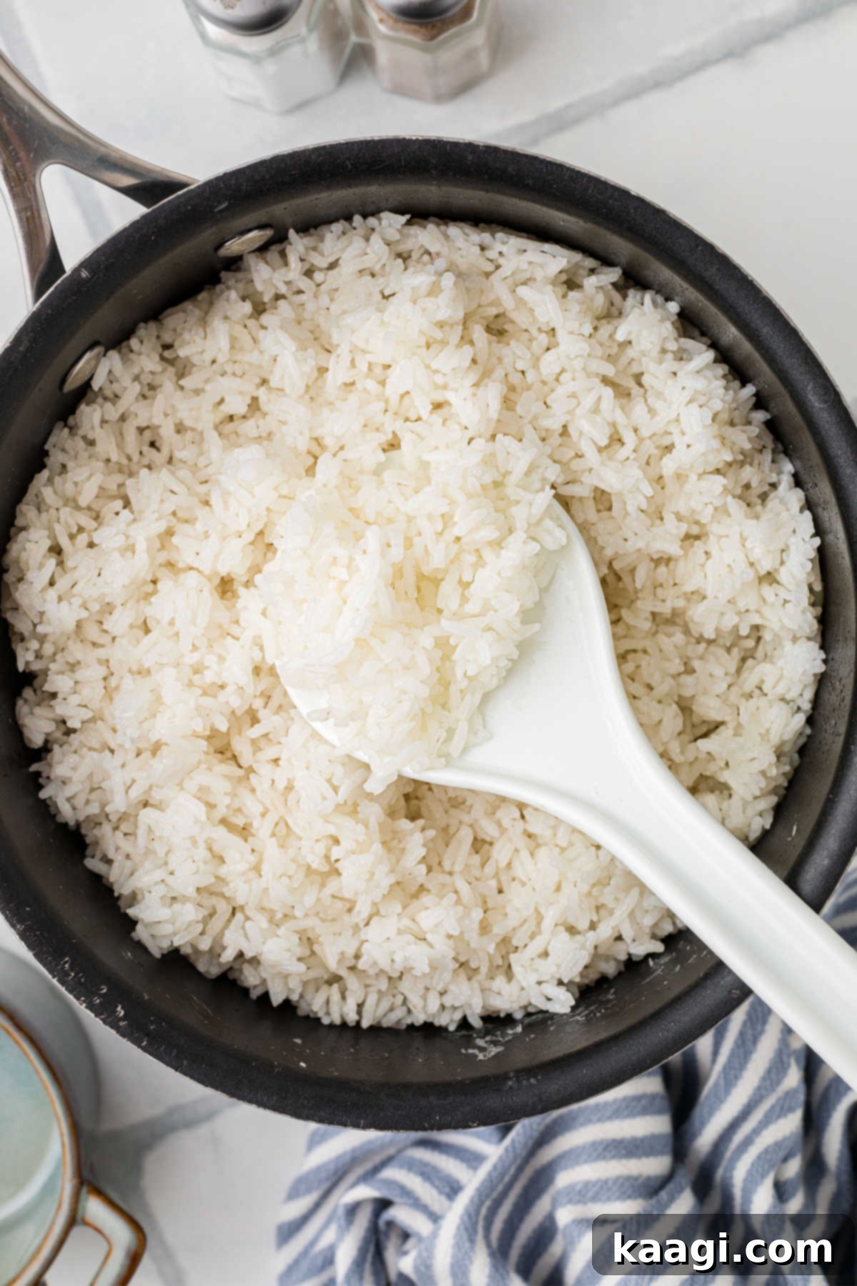 An overhead shot of a pan full of fluffy white rice.