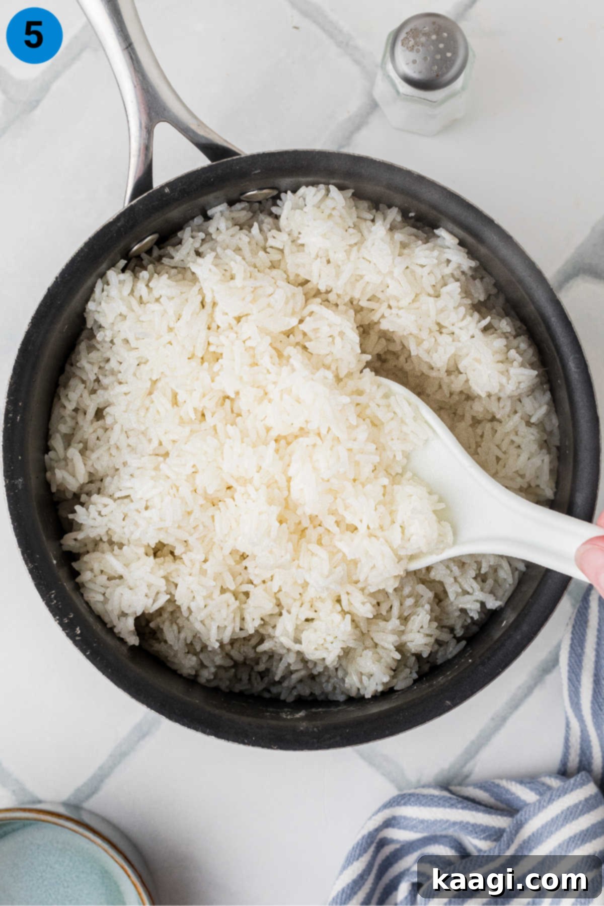 Overhead shot of a pot full of perfectly cooked white rice.