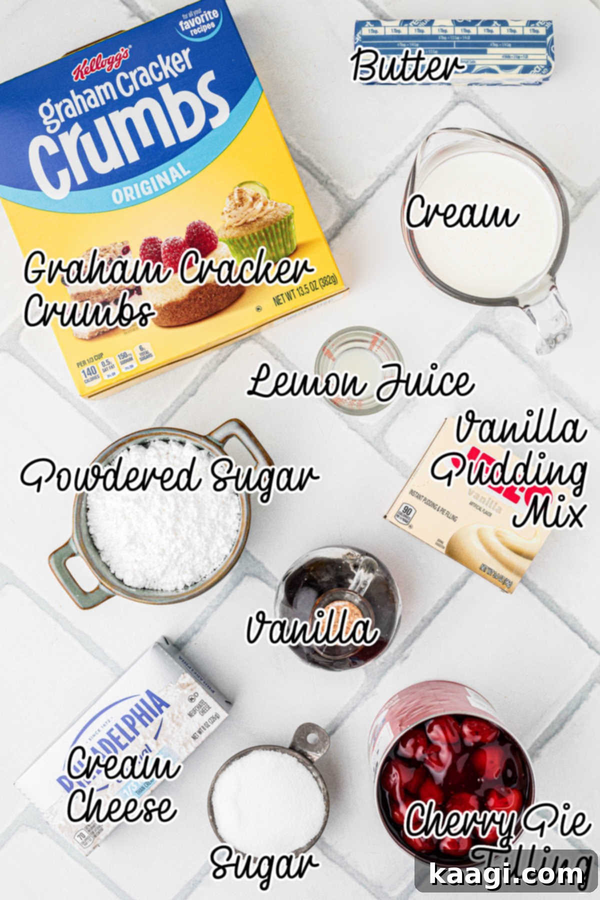 A flat lay of all the fresh ingredients needed to make an old fashioned cherry delight, including cream cheese, graham crackers, and cherry pie filling.