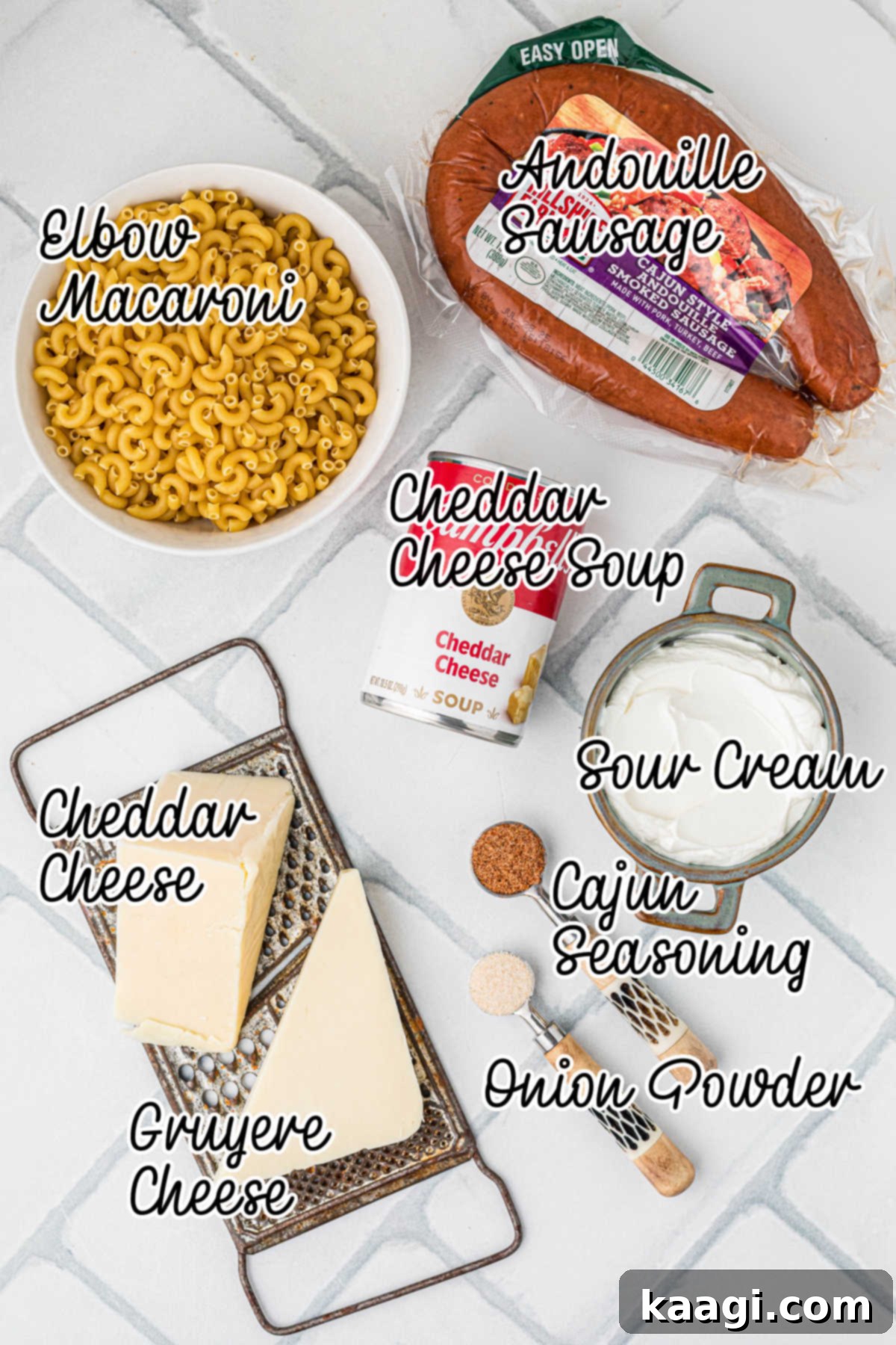 A collection of fresh ingredients laid out on a table, including cheeses, pasta, sour cream, and Andouille sausage, ready for a slow cooker Cajun mac and cheese recipe.