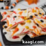 Creepy Crunch Bark 13 A plate with chocolate bark broken up into pieces, with fall colors.