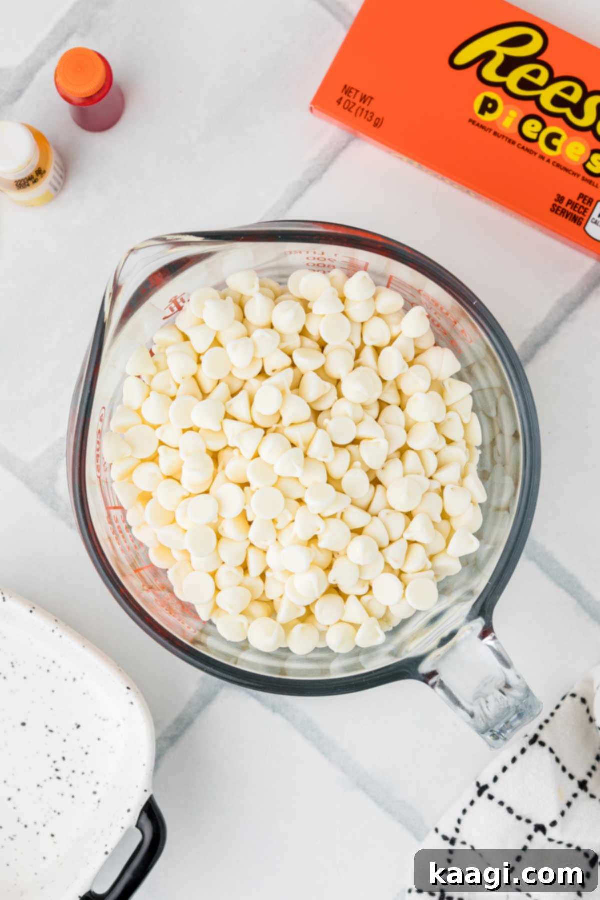 Creepy Crunch Bark 4 White chocolate chips in a mixing jug, ready to be melted in the microwave for the bark recipe.