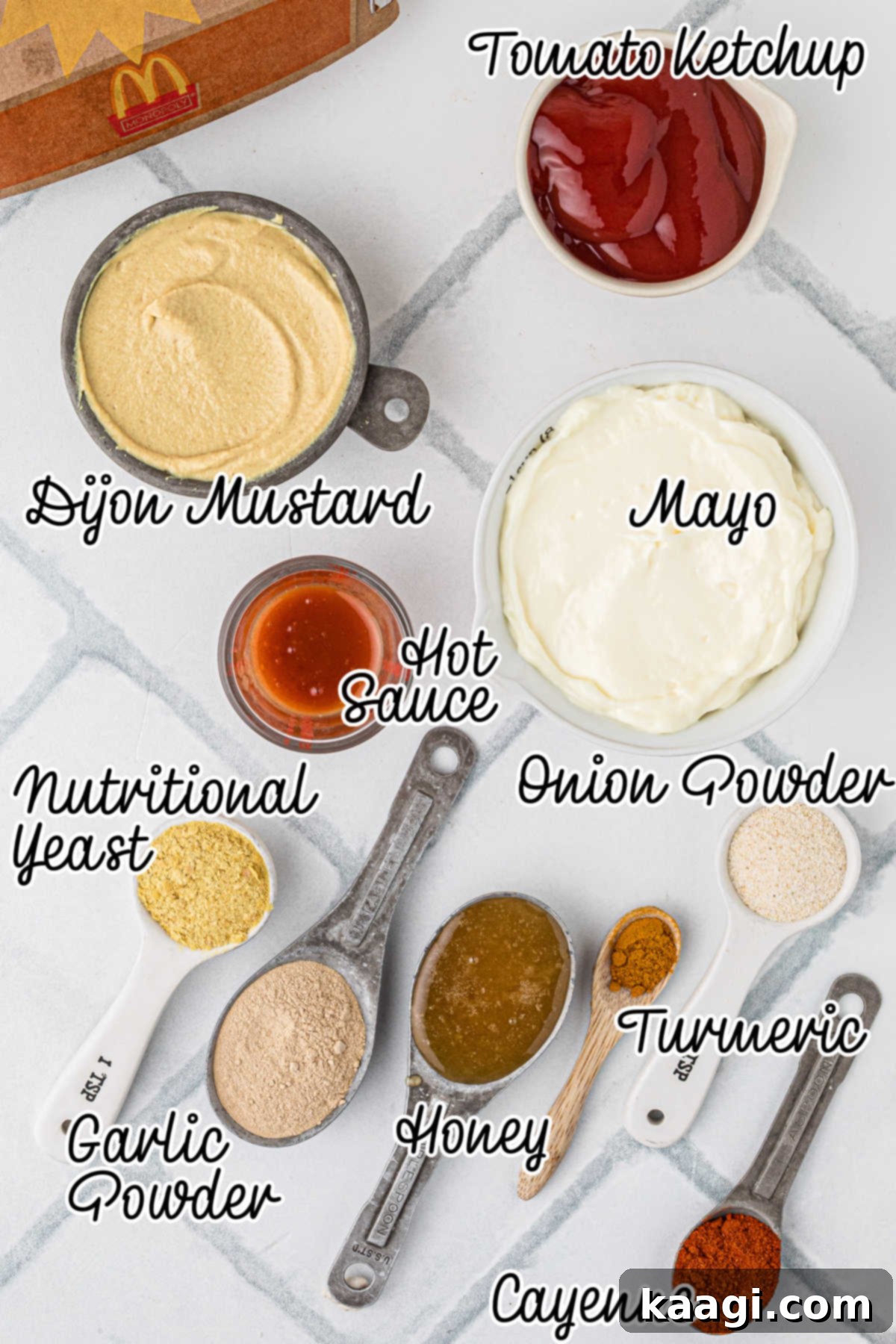 Ingredients needed to make a Cajun Sauce recipe, all laid out and text overlaid.