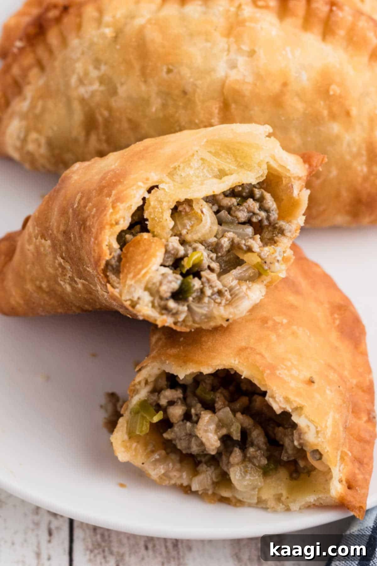 Savory Natchitoches Meat Pies A Louisiana Classic 2 A Natchitoches Meat Pie Recipe image of a pie in half, revealing its savory filling.