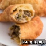 Savory Natchitoches Meat Pies A Louisiana Classic 8 A natchitoches meat pie cut in half, showcasing the flavorful filling.