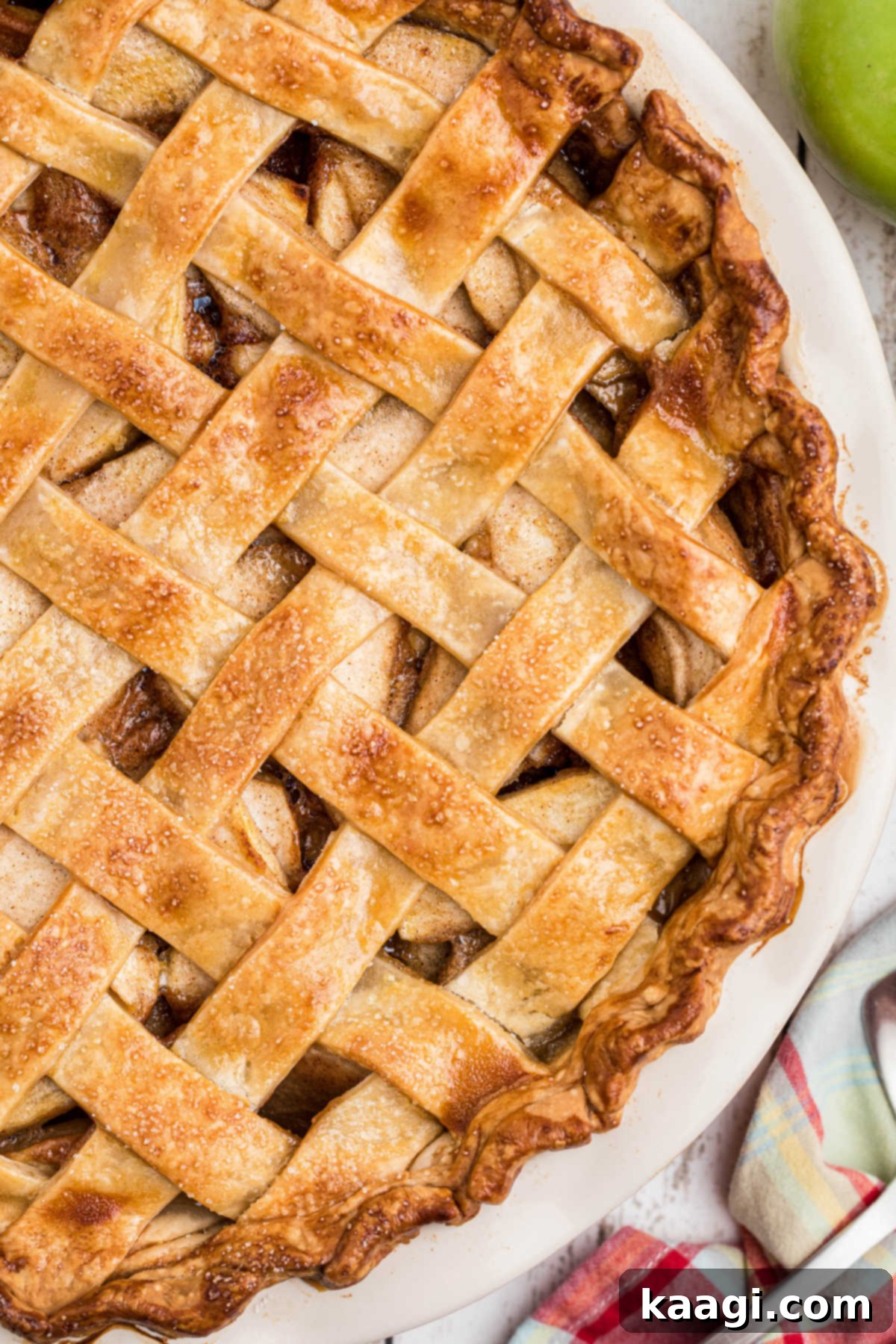 Overhead shot of a baked country apple pie, with latticed pastry.