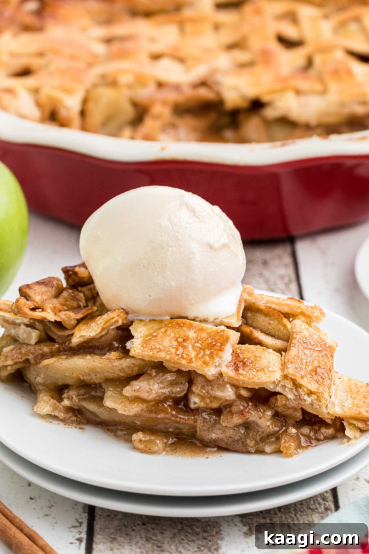 Close up of a slice of country apple pie.