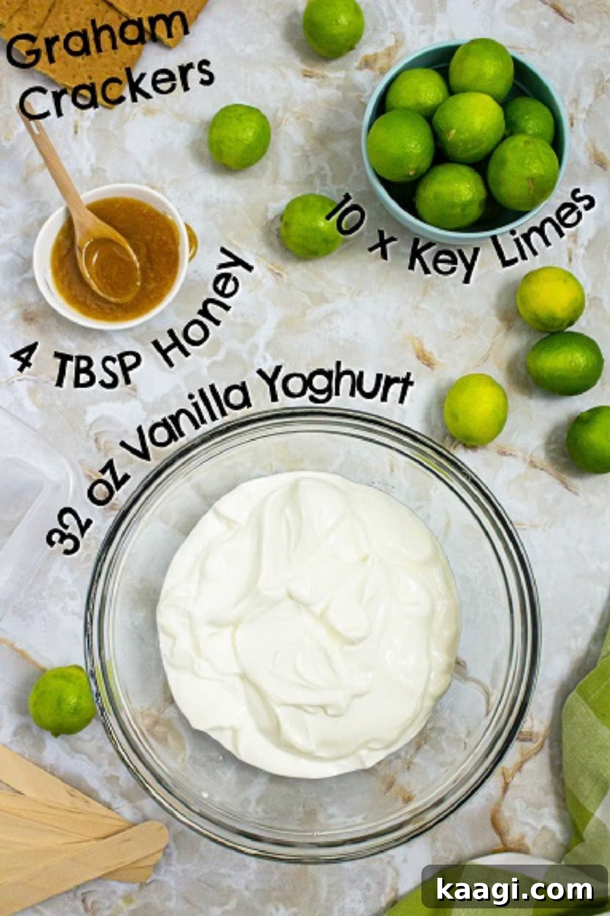 Zesty Key Lime Pops 3 A selection of fresh ingredients including vibrant Key limes, a jar of honey, and creamy yogurt, laid out for making Key Lime Pie Popsicles.