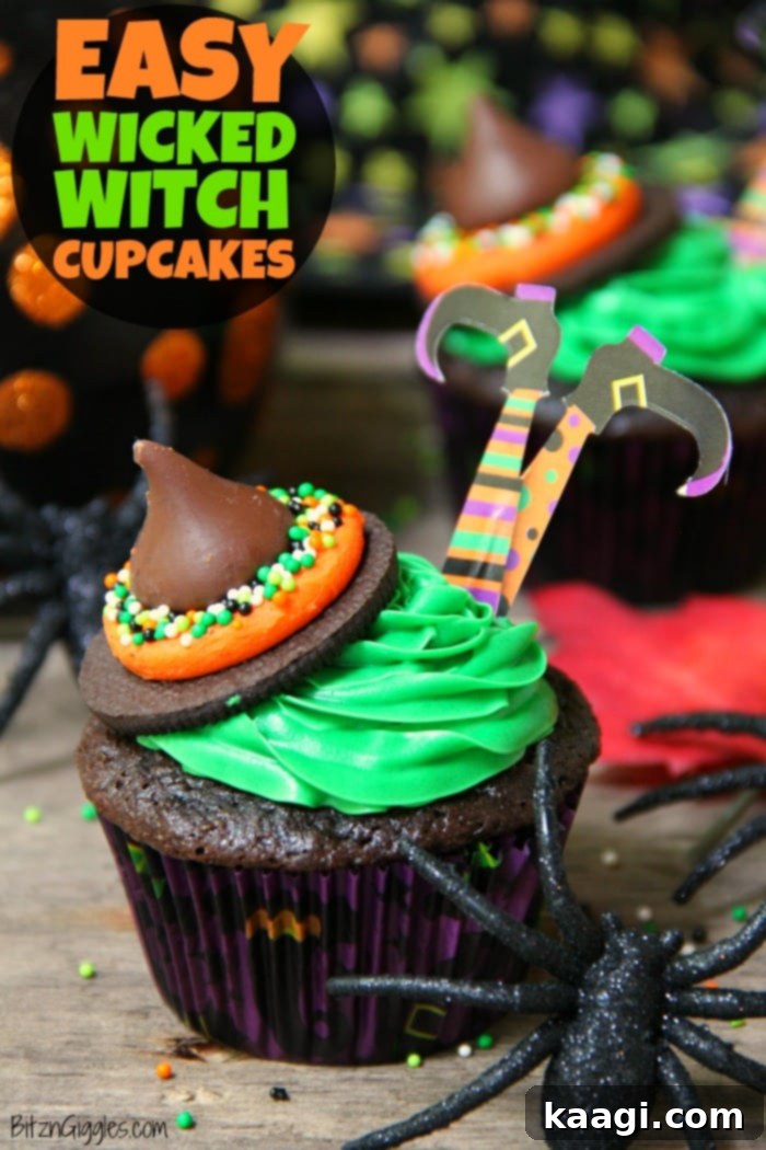 Easy Wicked Witch Cupcakes with green frosting and witch hat decorations, presented on a platter.