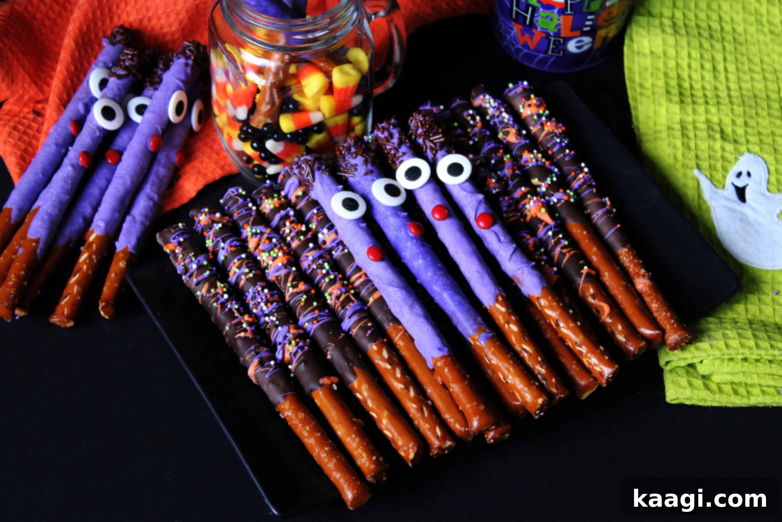 Assorted Halloween Pretzel Rods, dipped in chocolate and decorated with spooky eyes and festive sprinkles.