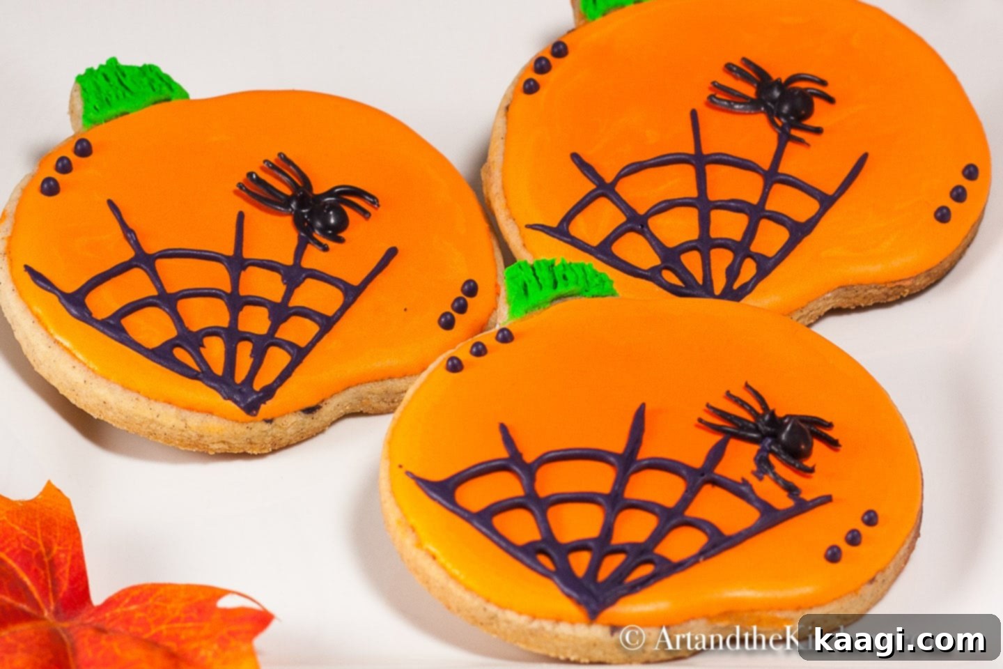 Delicious Pumpkin Spice Halloween Cookies decorated with royal icing in festive Halloween designs.