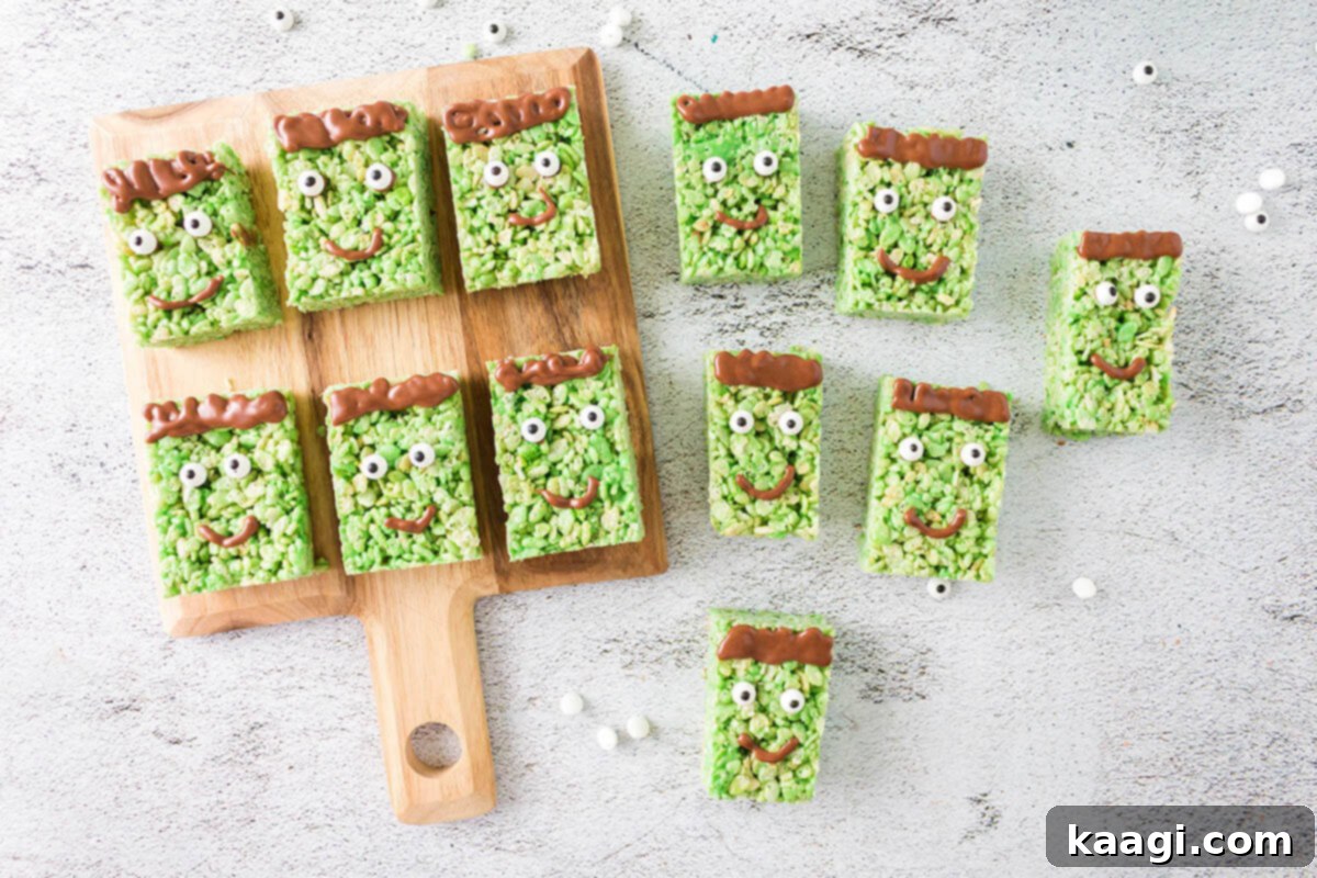 Playful Frankenstein Rice Krispie Treats with green frosting, edible eyes, and chocolate details.