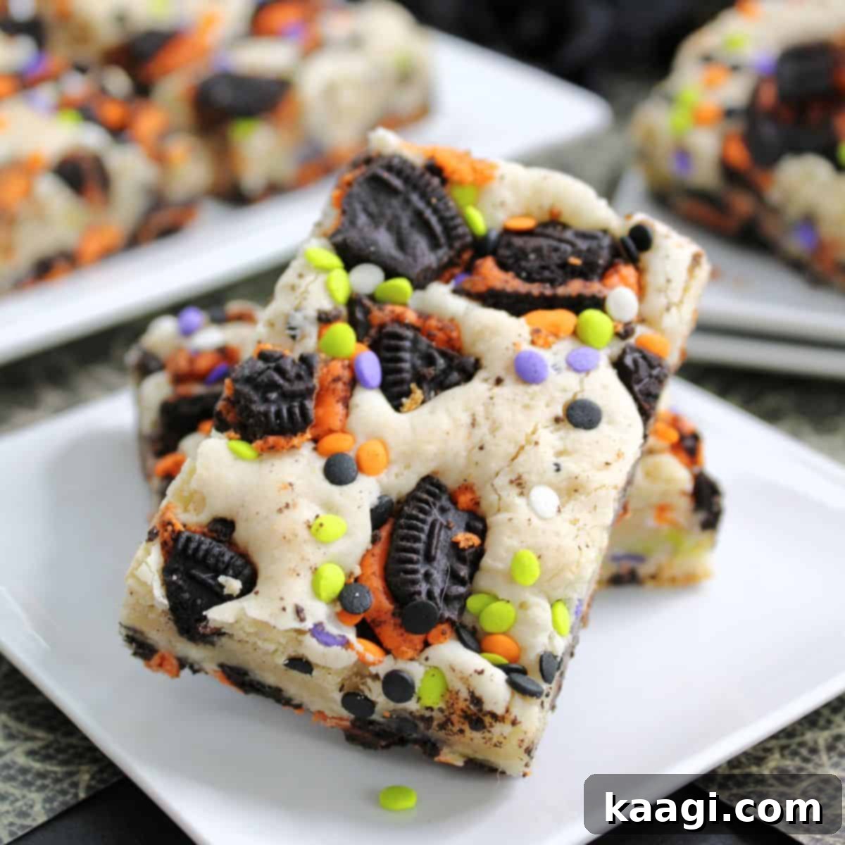 Gooey Halloween Oreo Cake Bars, filled with Halloween Oreos and festive sprinkles.