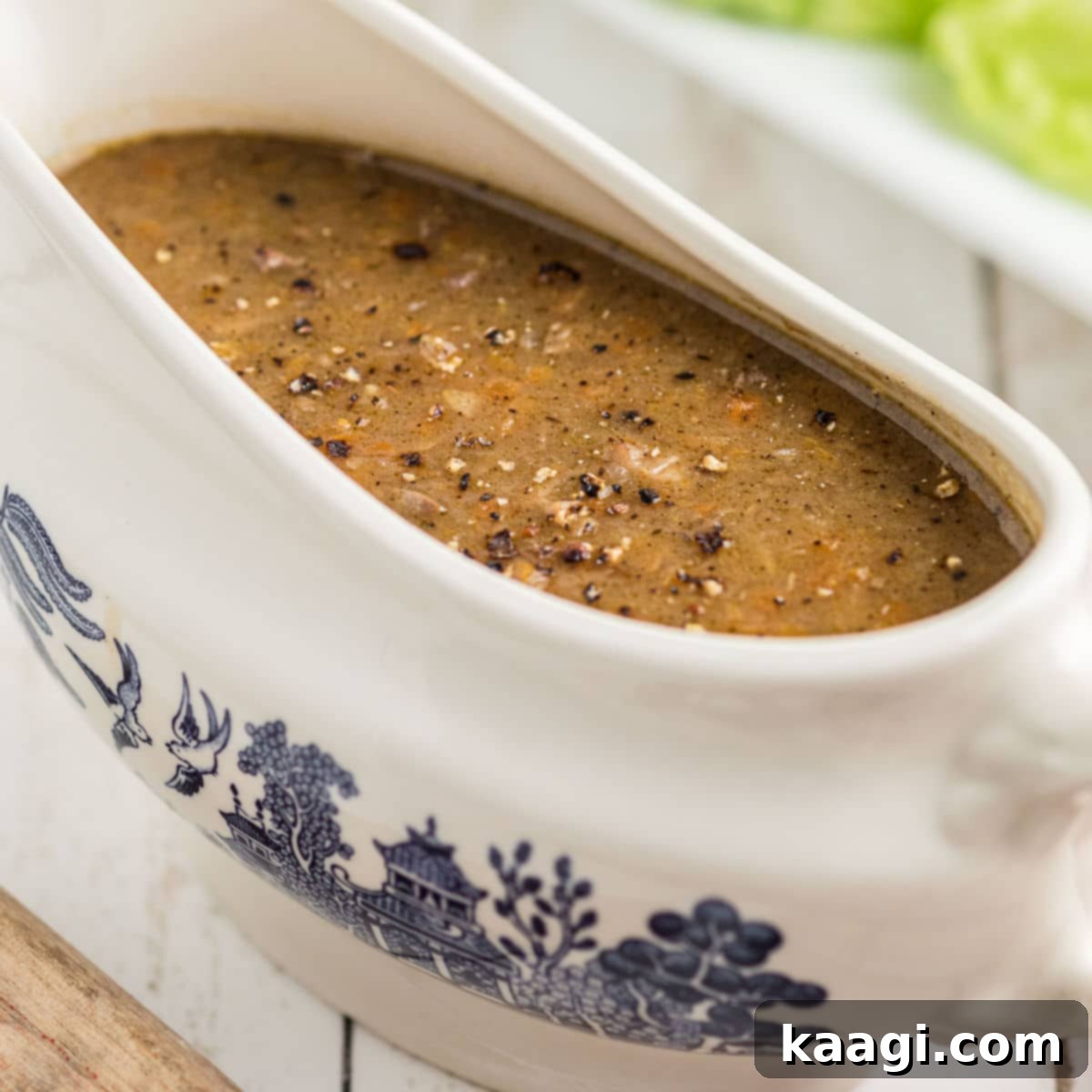 Close up of a classic Southern giblet gravy in a elegant gravy boat.