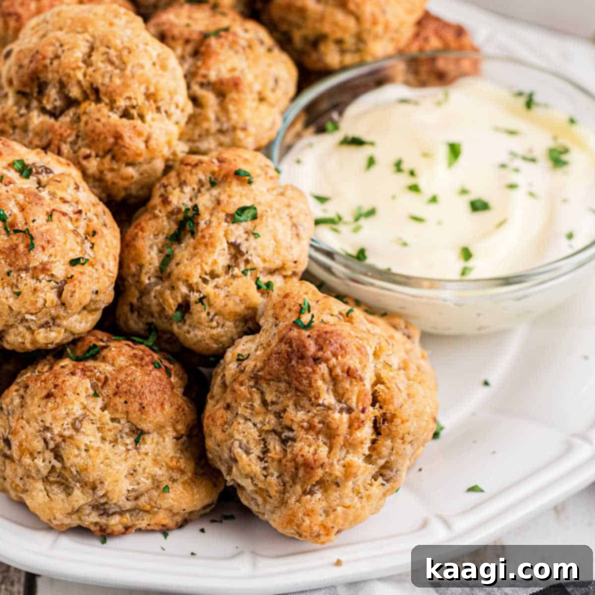 Close up of delicious Cheddar Bay Sausage Balls with ranch dipping sauce.