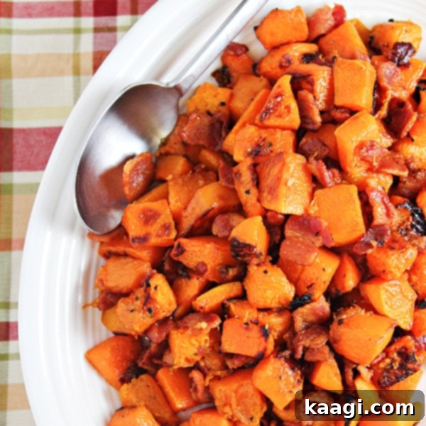 Delicious Maple Glazed Butternut Squash with Bacon, glistening with sweet and savory flavors.