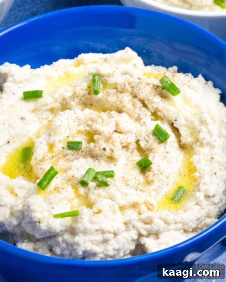 Creamy cauliflower mash with a dollop of sour cream, a perfect low-carb option.