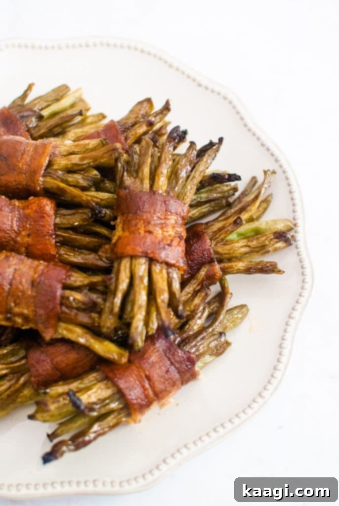 Elegant bacon wrapped green bean bundles, perfectly cooked and tied.