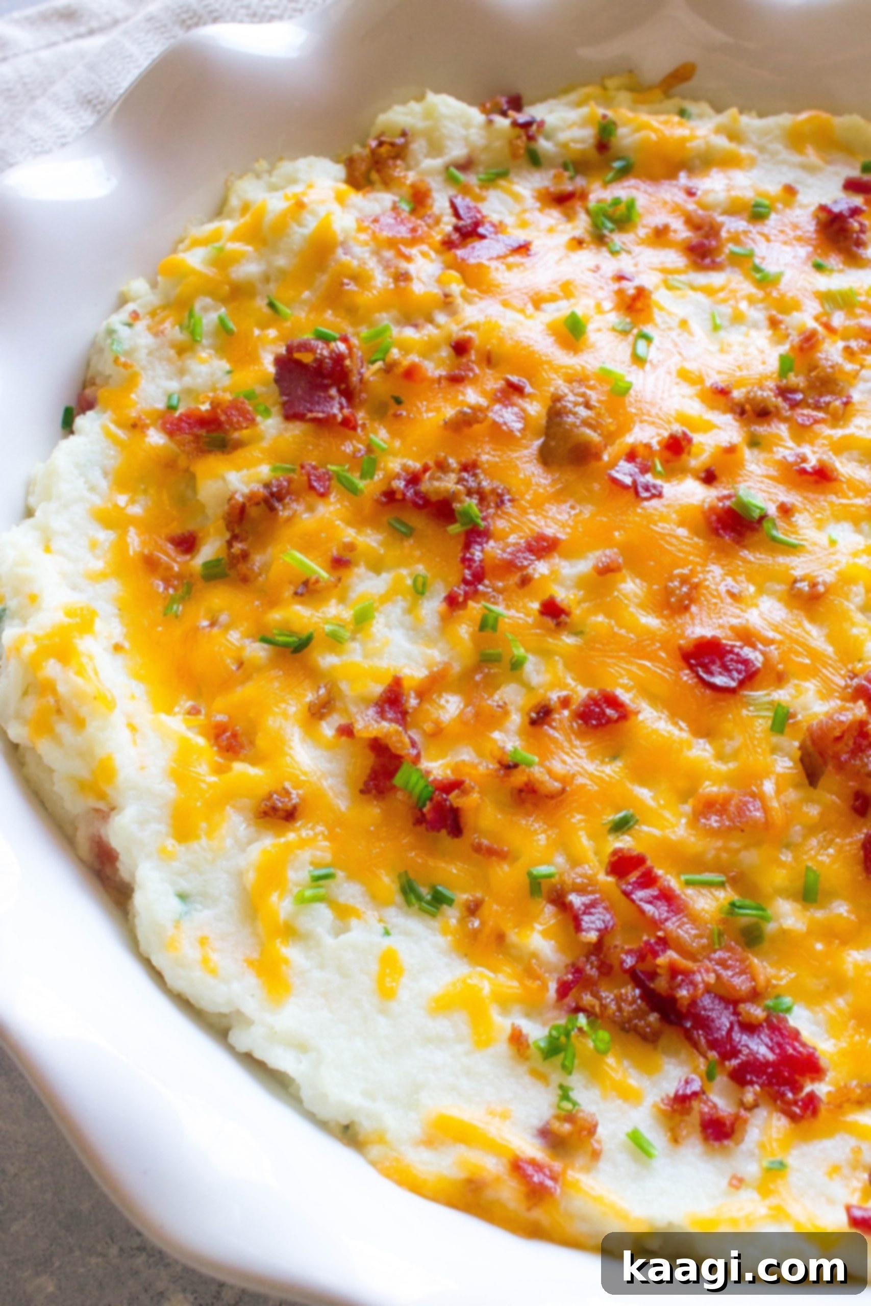 A hearty Loaded Cheesy Cauliflower Bake, similar to a loaded baked potato.