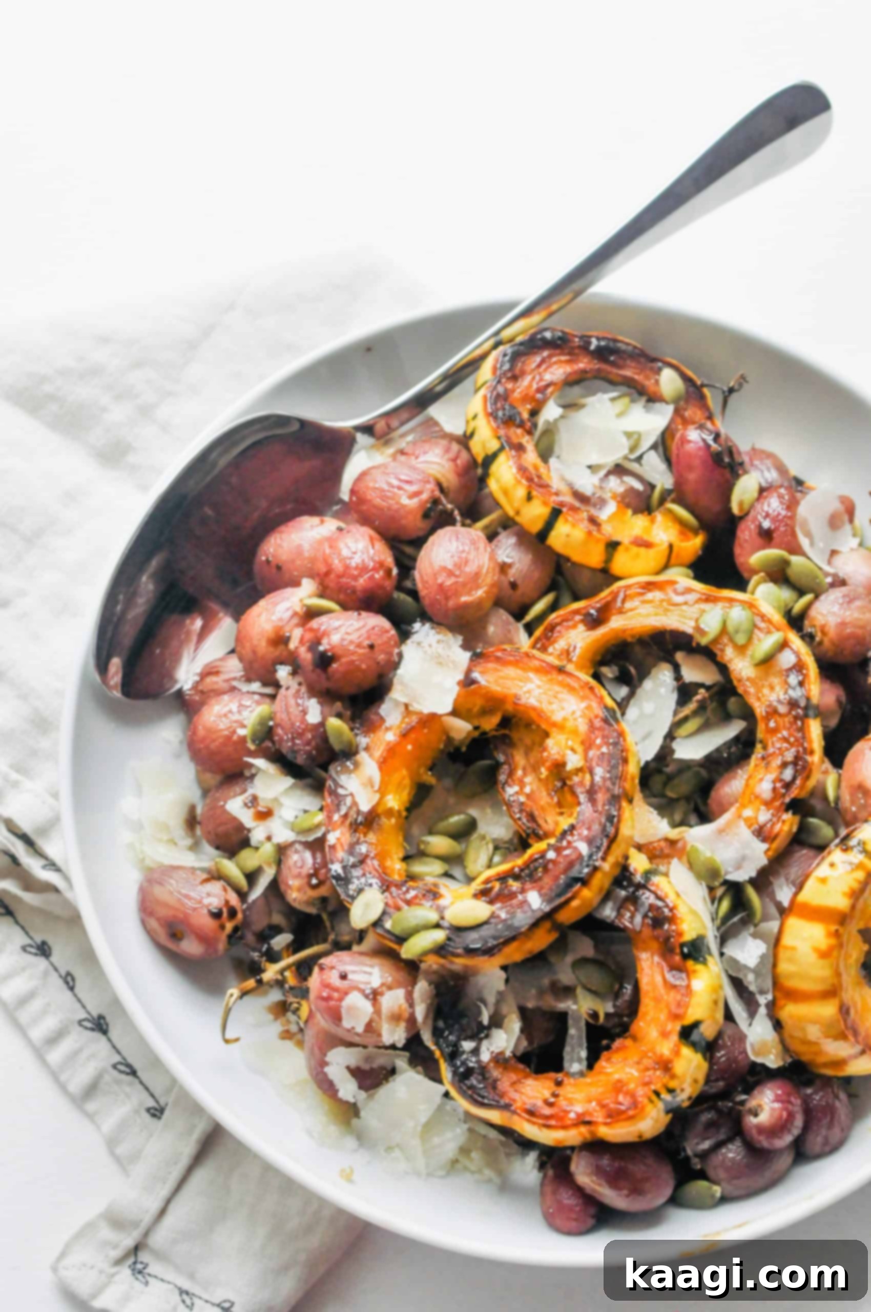 An elegant platter of roasted squash and grapes, a unique holiday side.