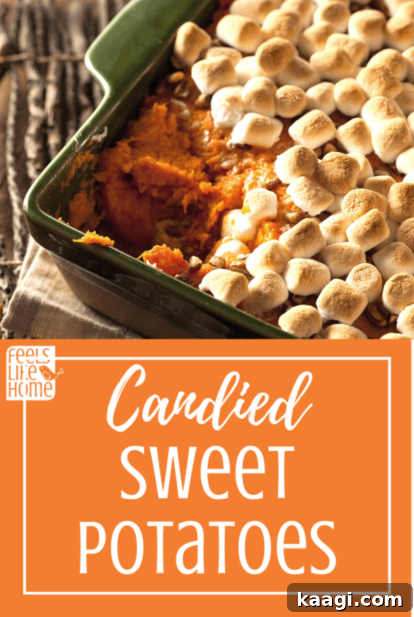 Glistening homemade candied sweet potatoes topped with toasted marshmallows.